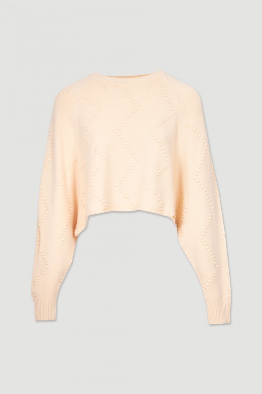 Pull court en maille relief
