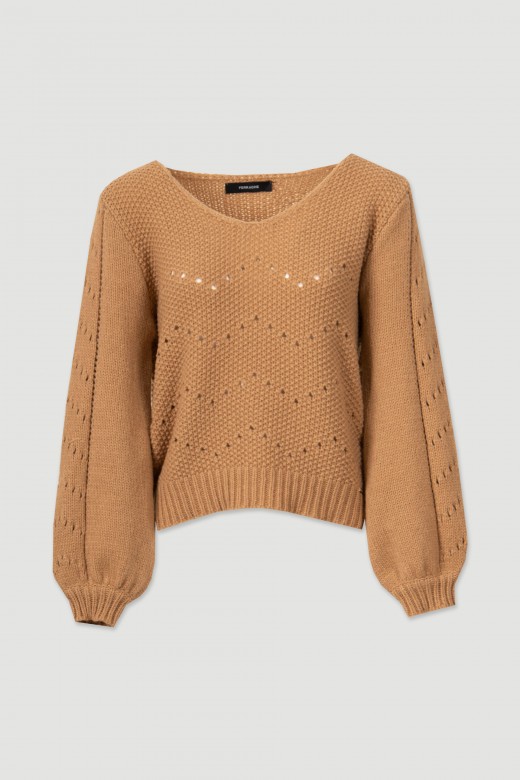 Thick knit sweater with perforations
