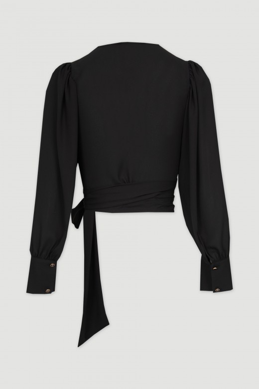 Top with long sleeves with bow closure