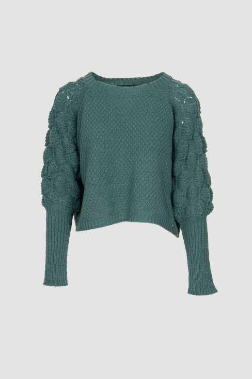 Thick knit sweater with perforations