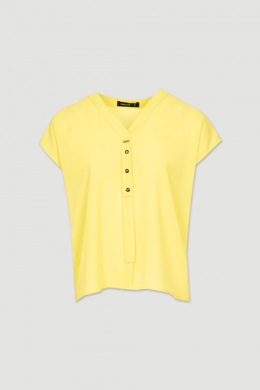 Blouse with button application
