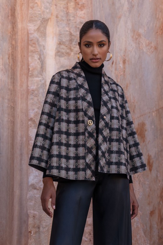 Textured fabric cape with pattern