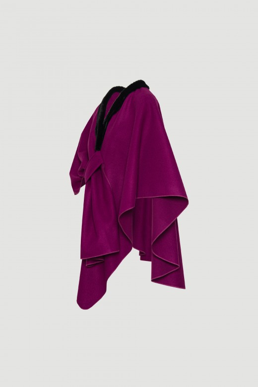 Woolen cape with wrap closure.