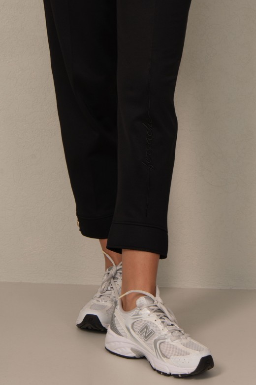 Jogger pants with embroidery detail on the leg
