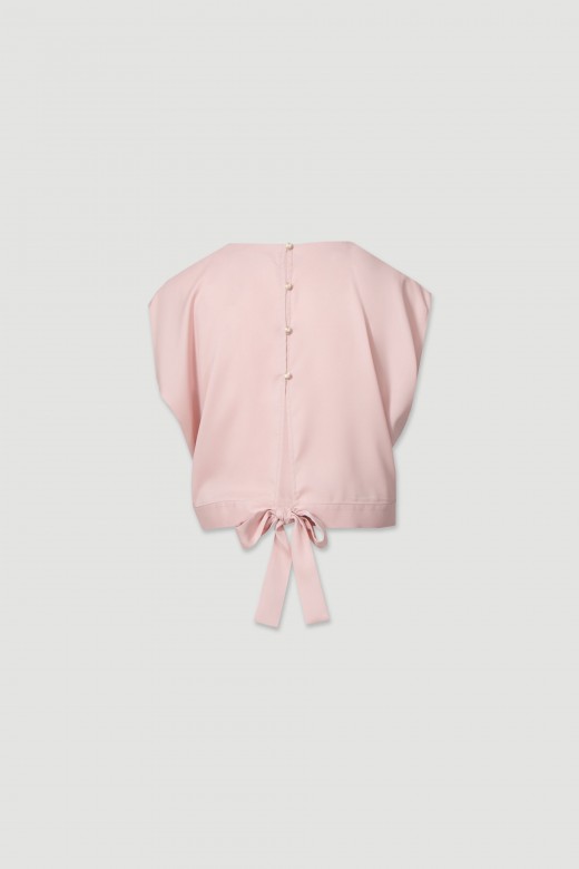 Blouse with a bow on the back