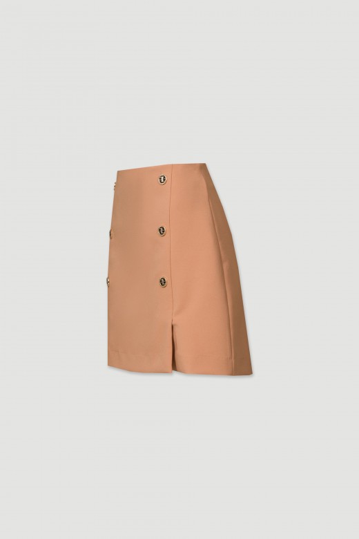 Short skirt with button detailing at the front