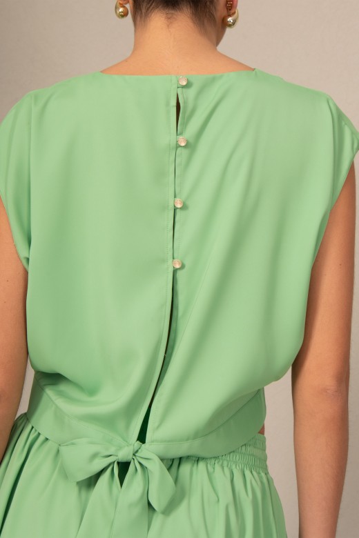 Blouse with a bow on the back