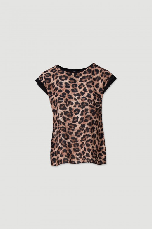 Top with animal print on the front