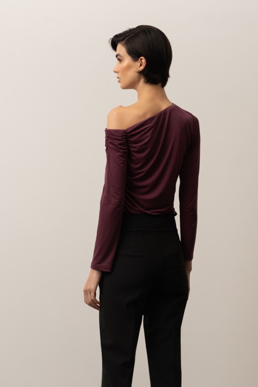 Knit sweater with an asymmetrical neckline and draped detail