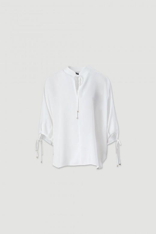 Tunic with bow detail at the neckline