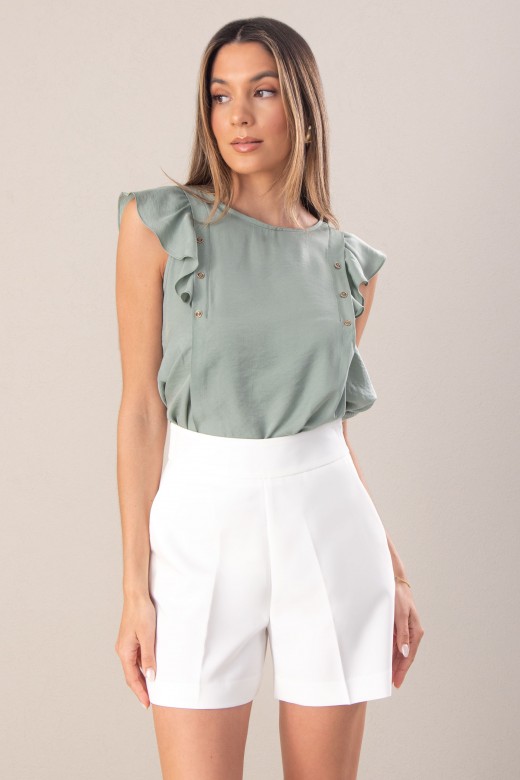 Blouse unie avec volant sur la manche