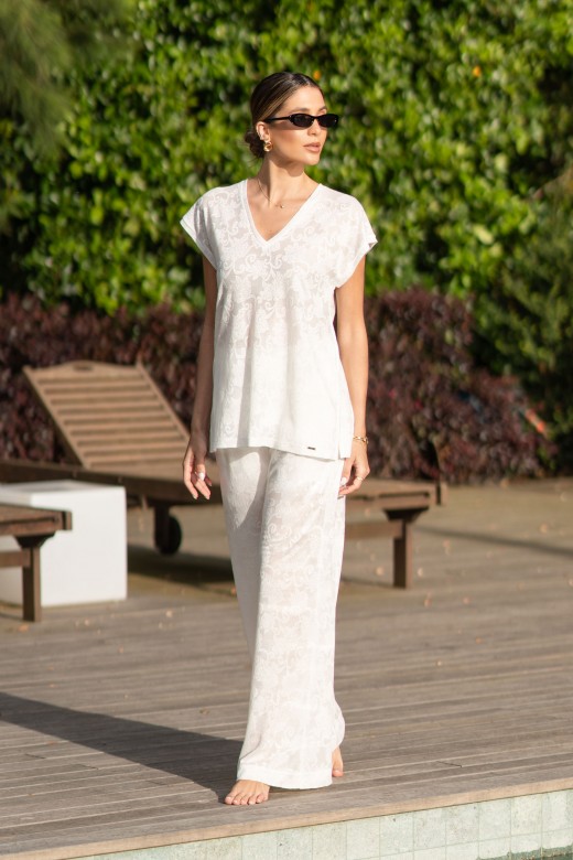 Fluid wide-leg trousers with embossed floral pattern Fluid wide-leg trousers with embossed floral pattern