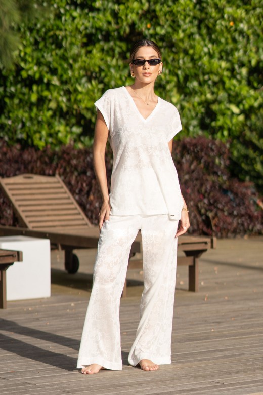 Fluid wide-leg trousers with embossed floral pattern