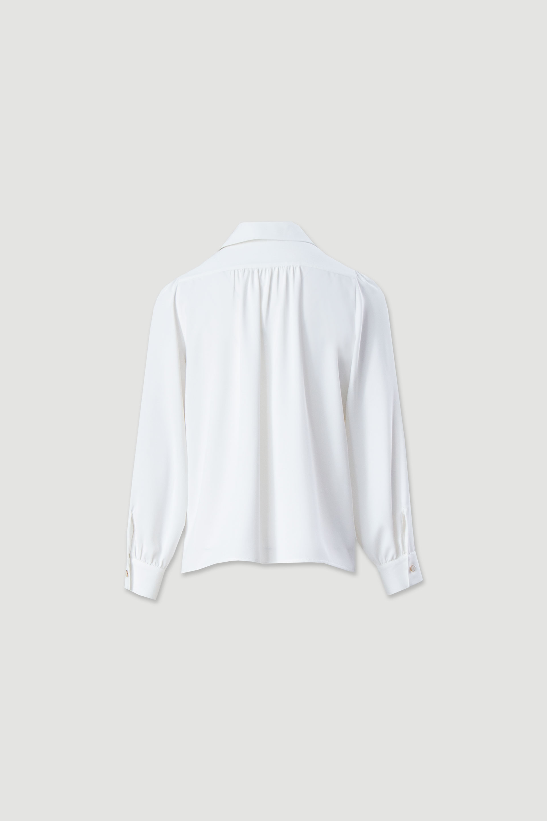 Túnica fluida con mangas abullonadas