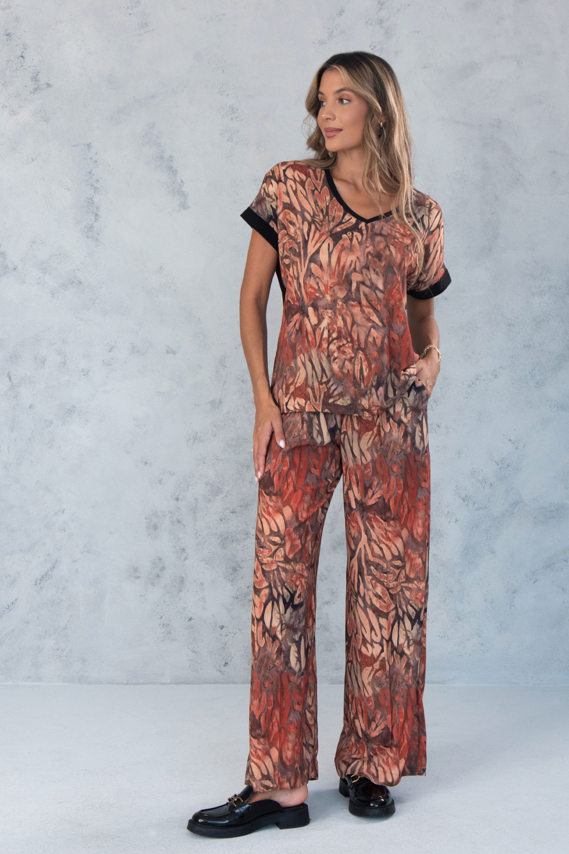 Túnica de malha estampada em v