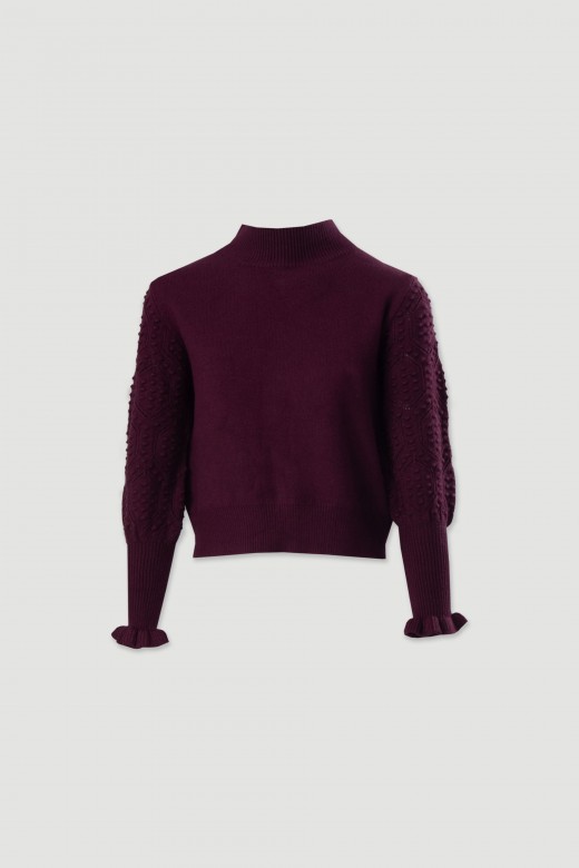 Knitted sweater with textured sleeves