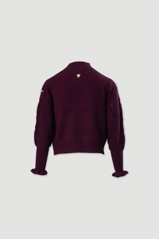 Knitted sweater with textured sleeves
