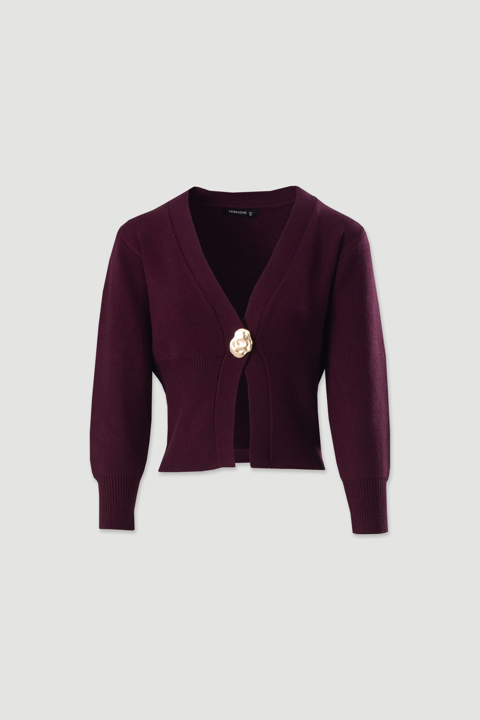 Casaco de malha com botão dourado