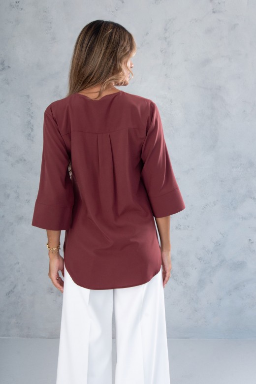 Tunique asymtrique avec dtail mtallique  lencolure