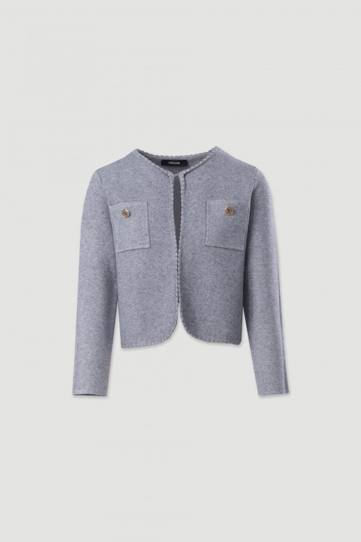 Veste courte en maille structure avec poches frontales