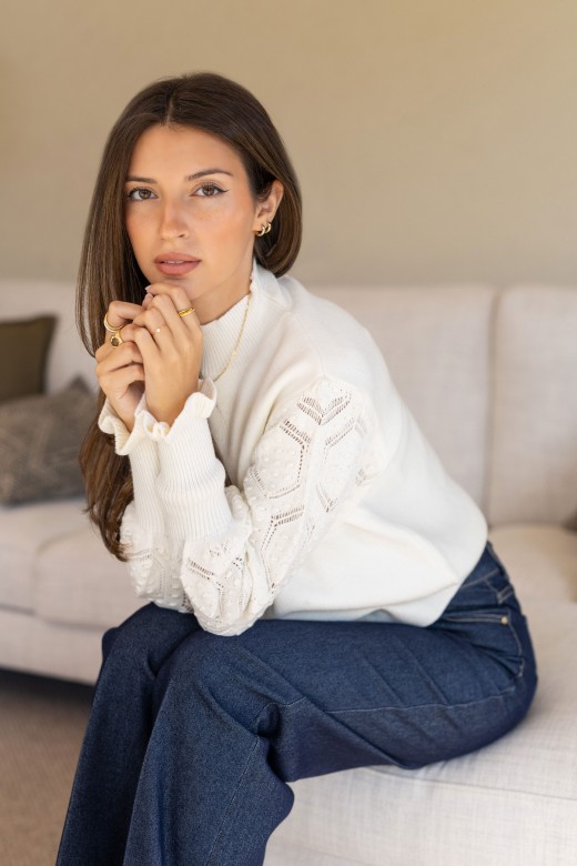 Knitted sweater with textured sleeves