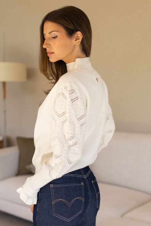Knitted sweater with textured sleeves