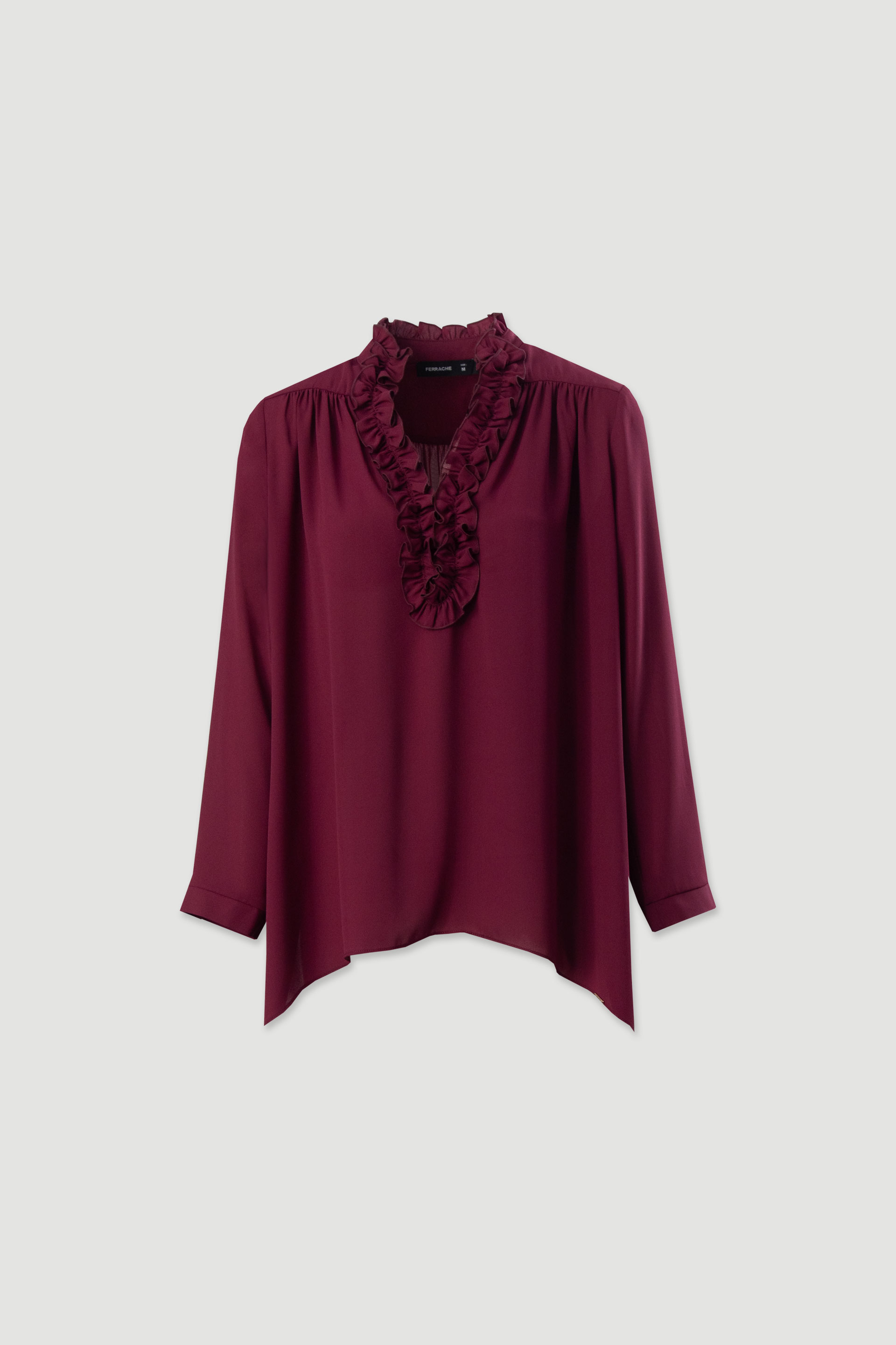 Túnica fluida con volante en el escote