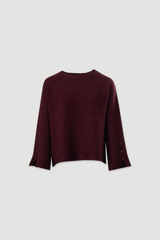 Pull en maille avec boutons dcoratifs sur les manches