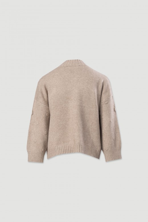 Knitted sweater with textured dots