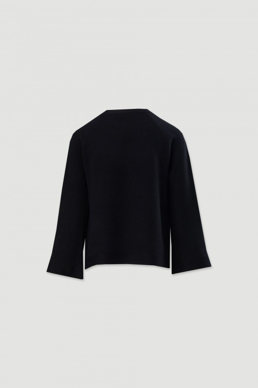 Knitted sweater with decorative sleeve buttons