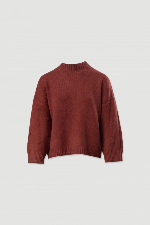 Knitted sweater with textured dots