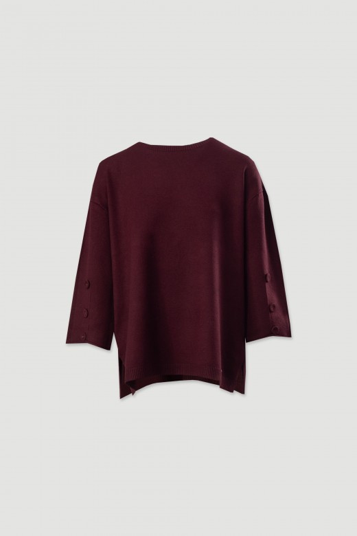 Camisola de malha fluda com botes nas mangas