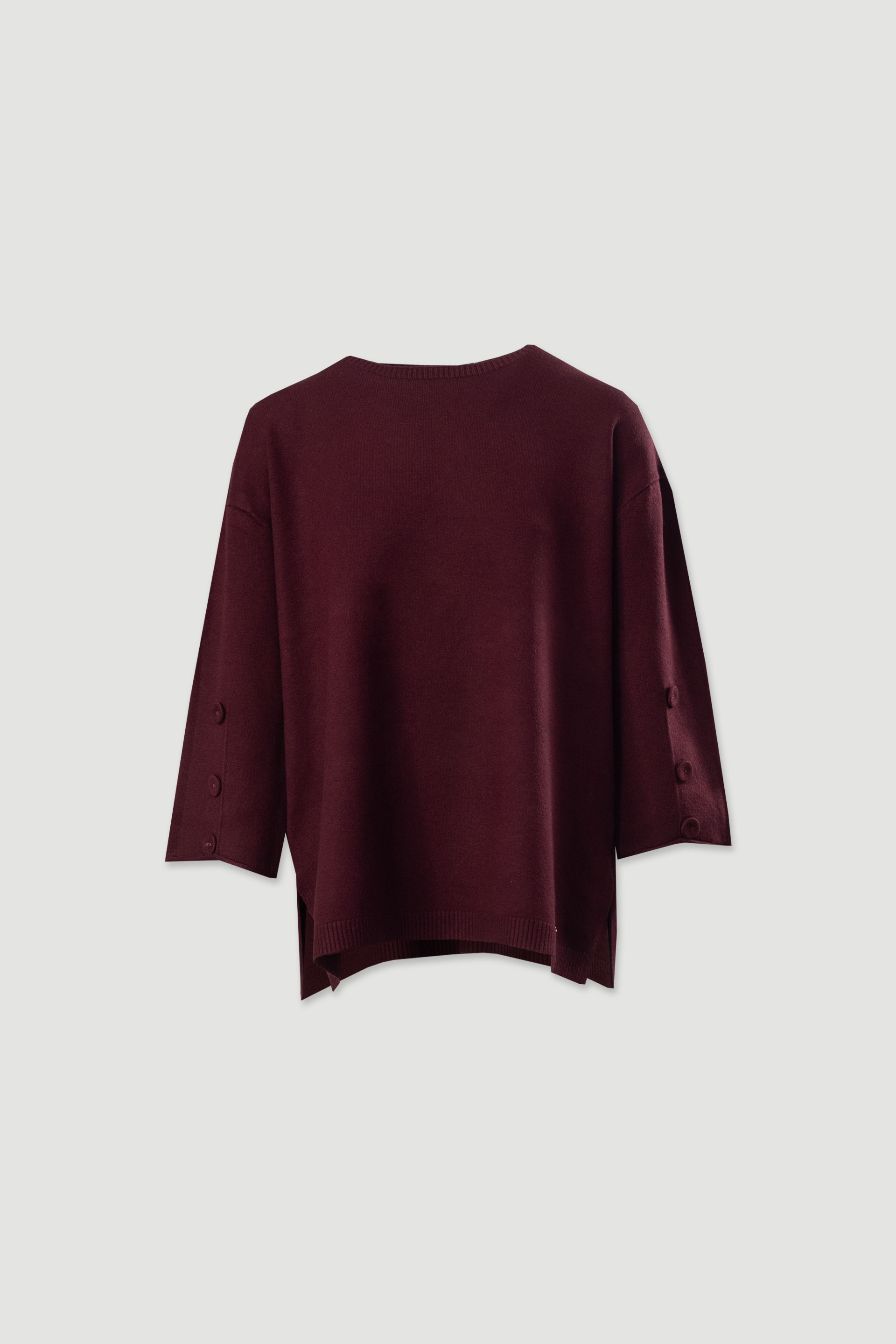 Camisola de malha fluída com botões nas mangas