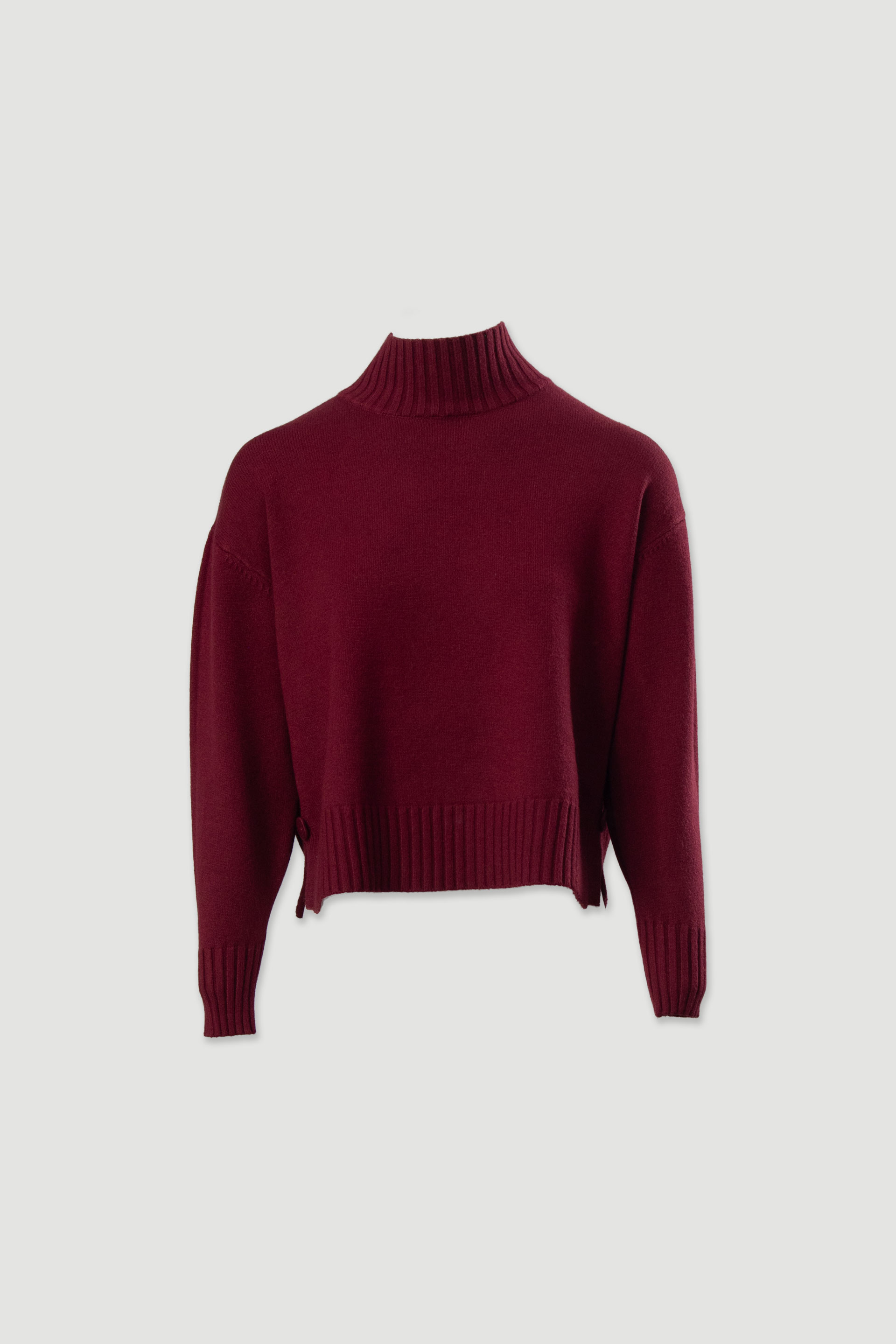 Camisola de malha com gola subida e botões laterais