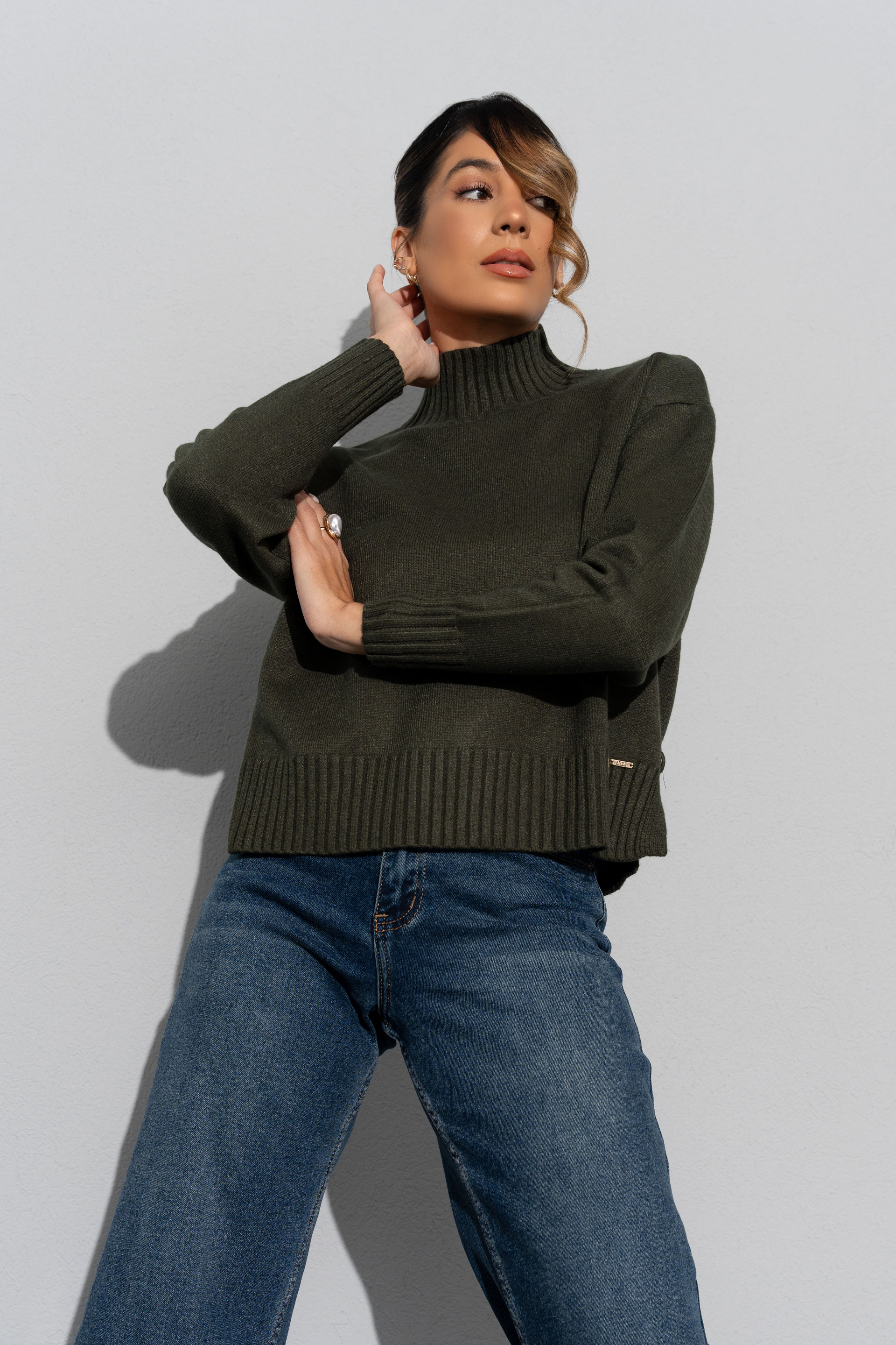 Knit sweater with high neck and side buttons