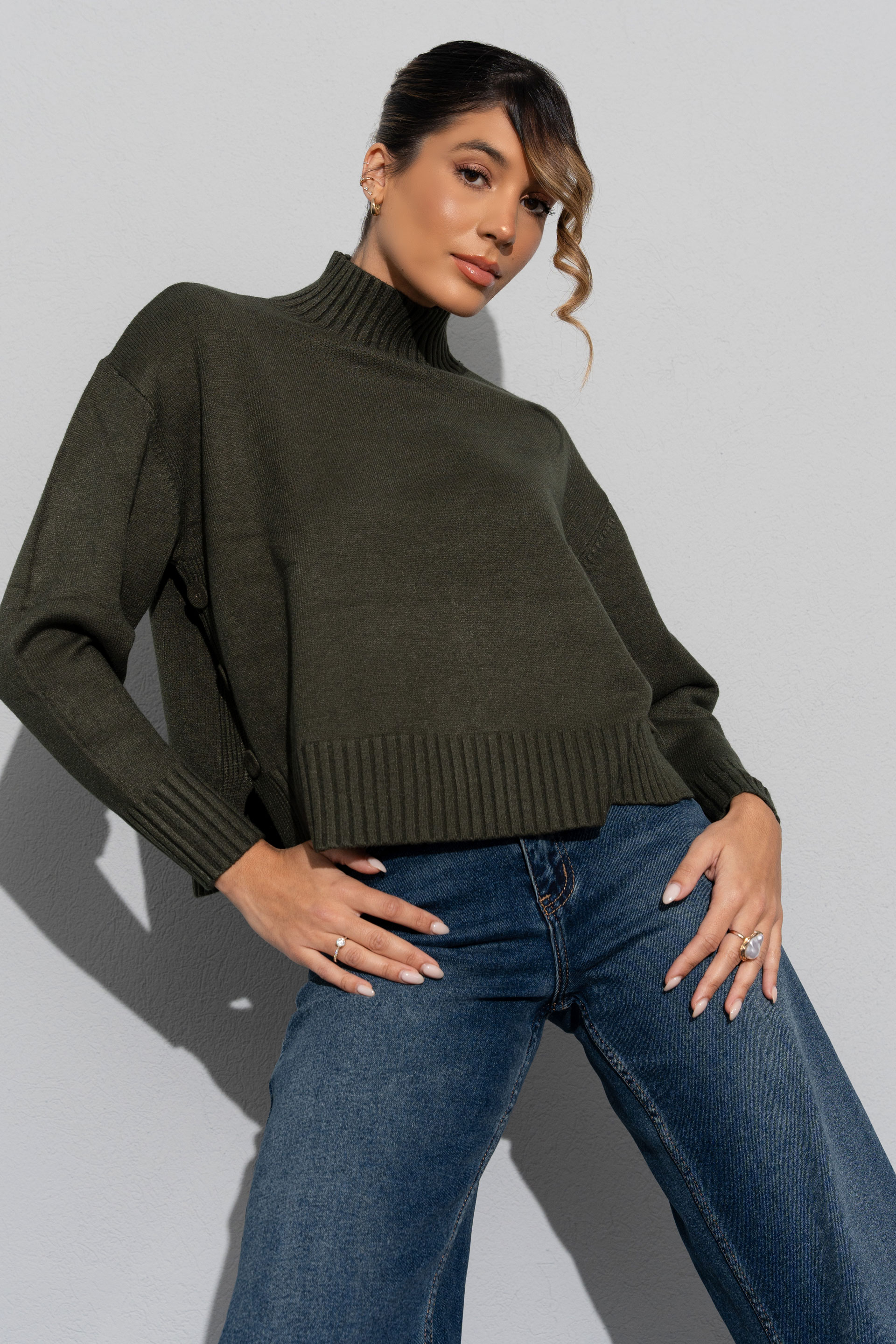 Knit sweater with high neck and side buttons