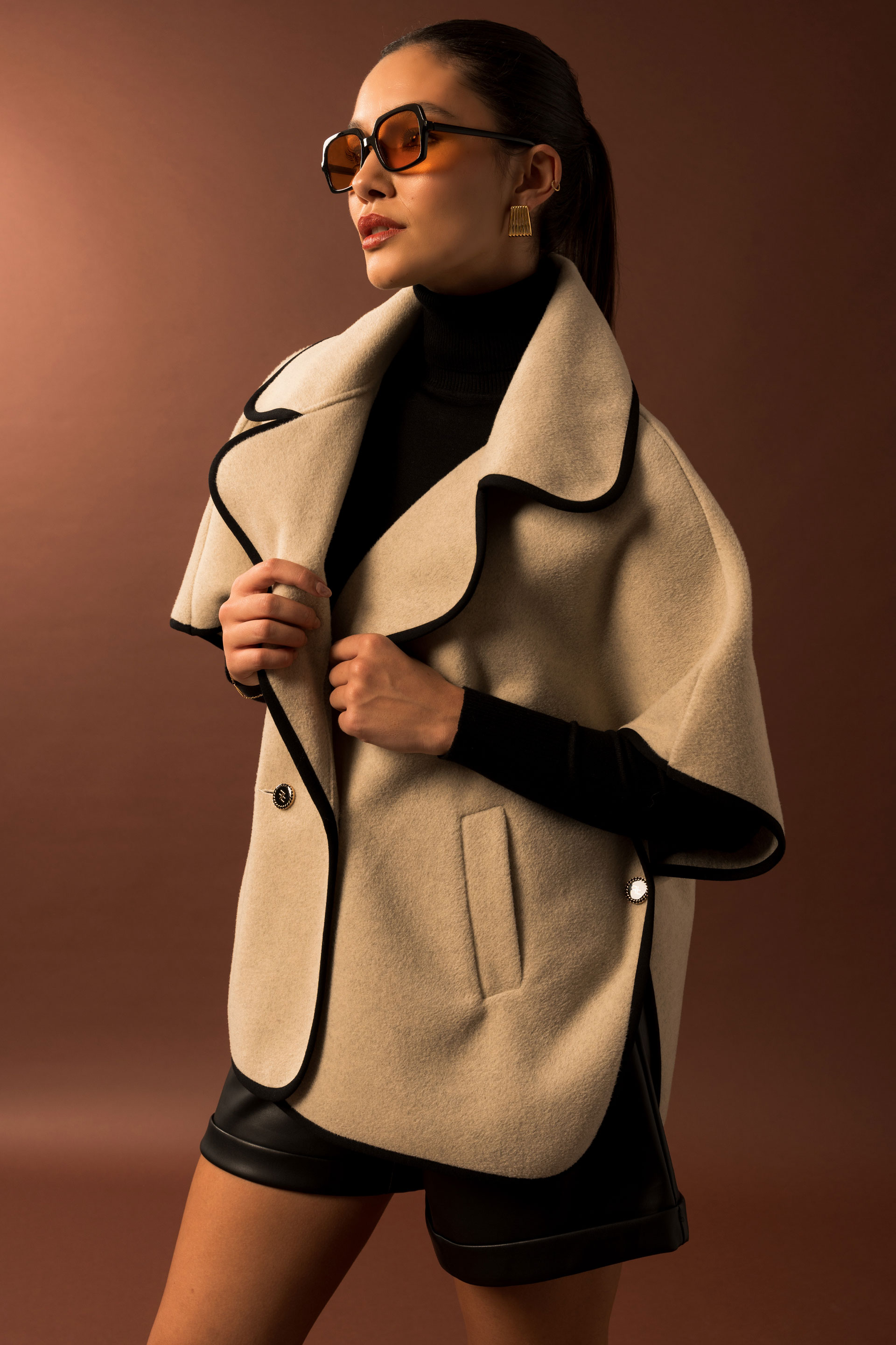 Cape with personalized button