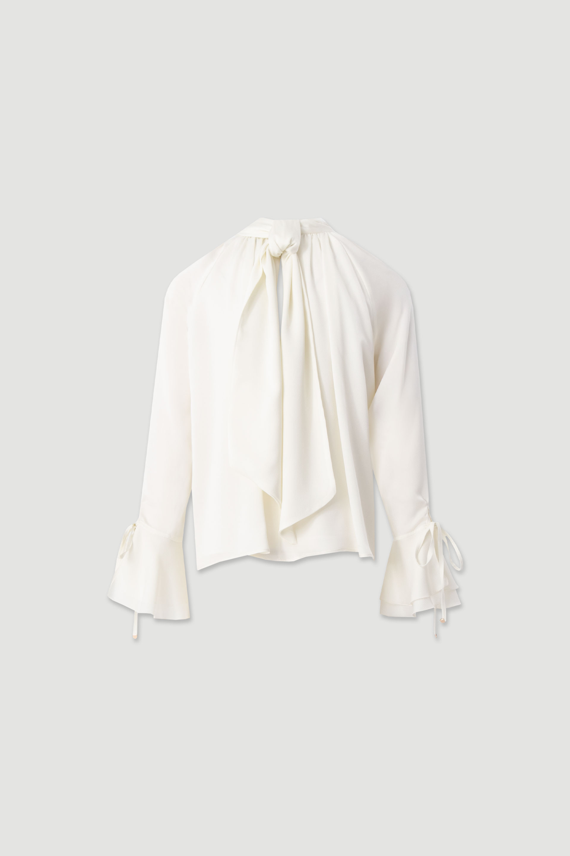 Fluid tunic with high neck and bow