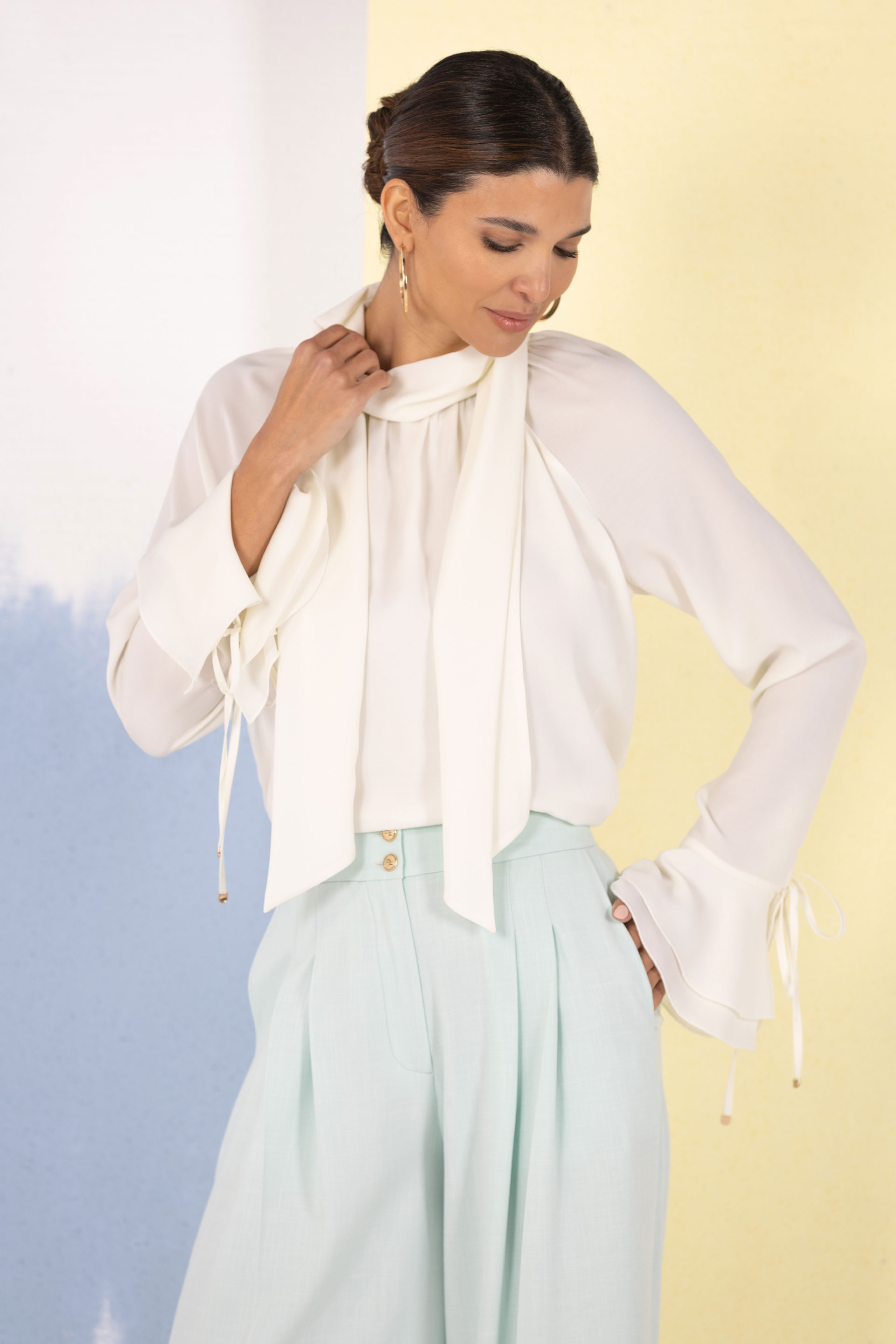 Fluid tunic with high neck and bow