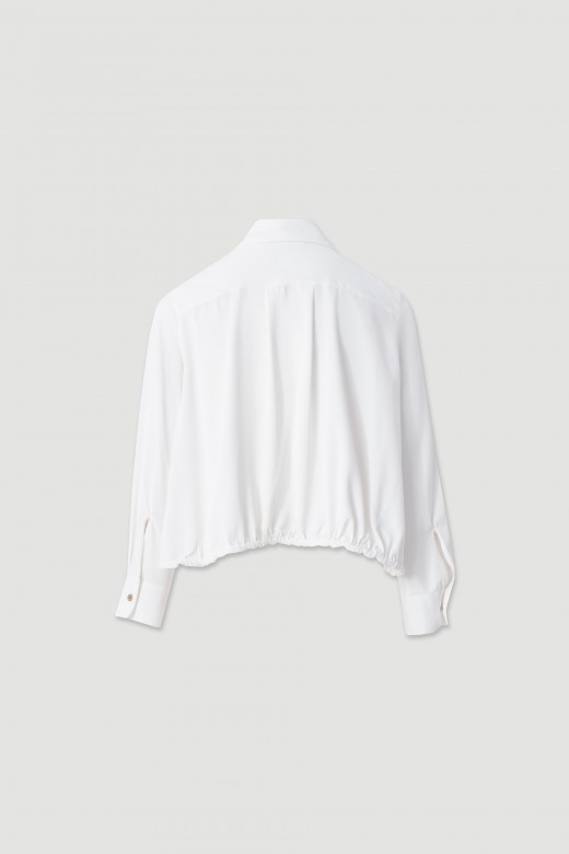 Fluid blouse with adjustable drawstring Fluid blouse with adjustable drawstring