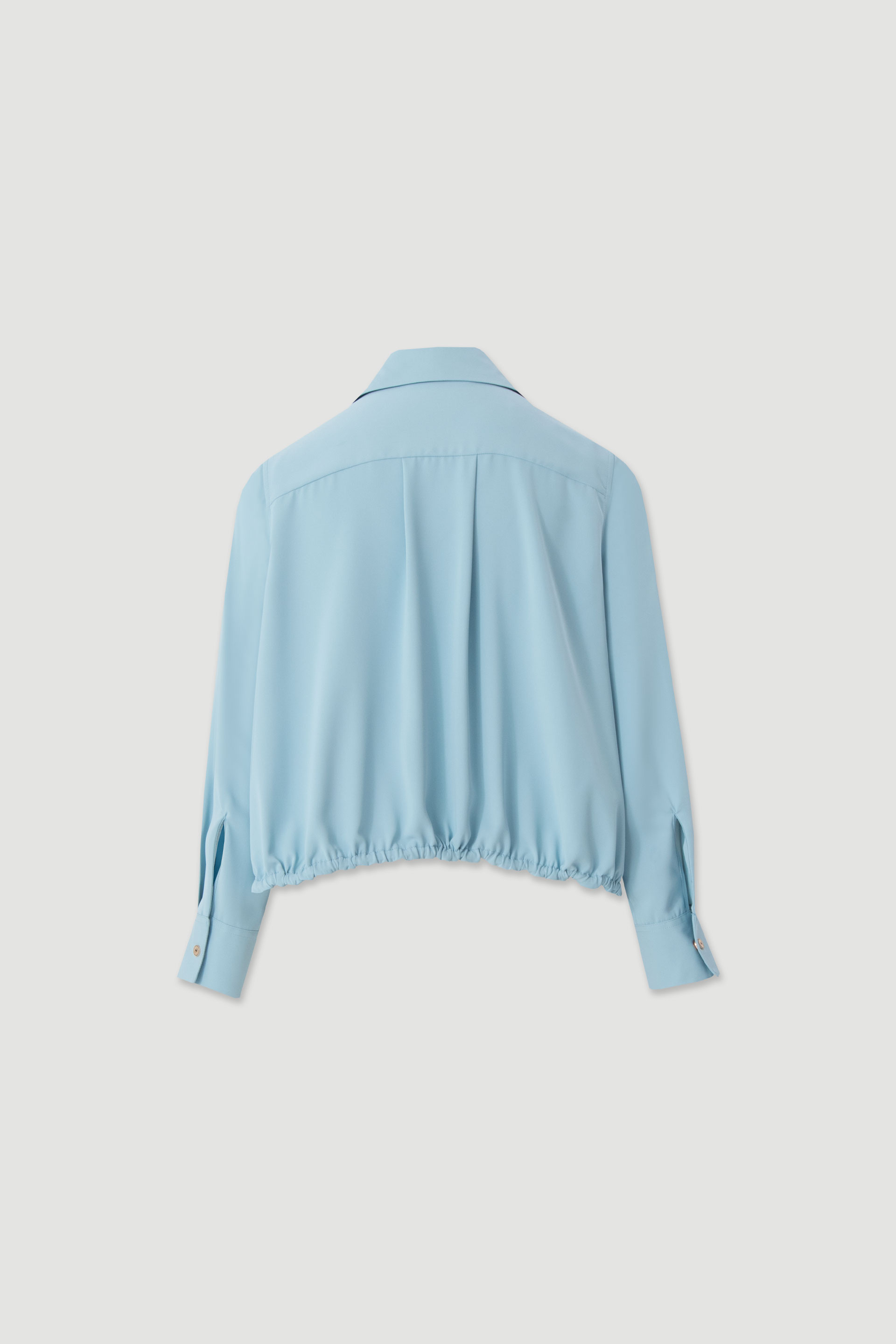 Fluid blouse with adjustable drawstring