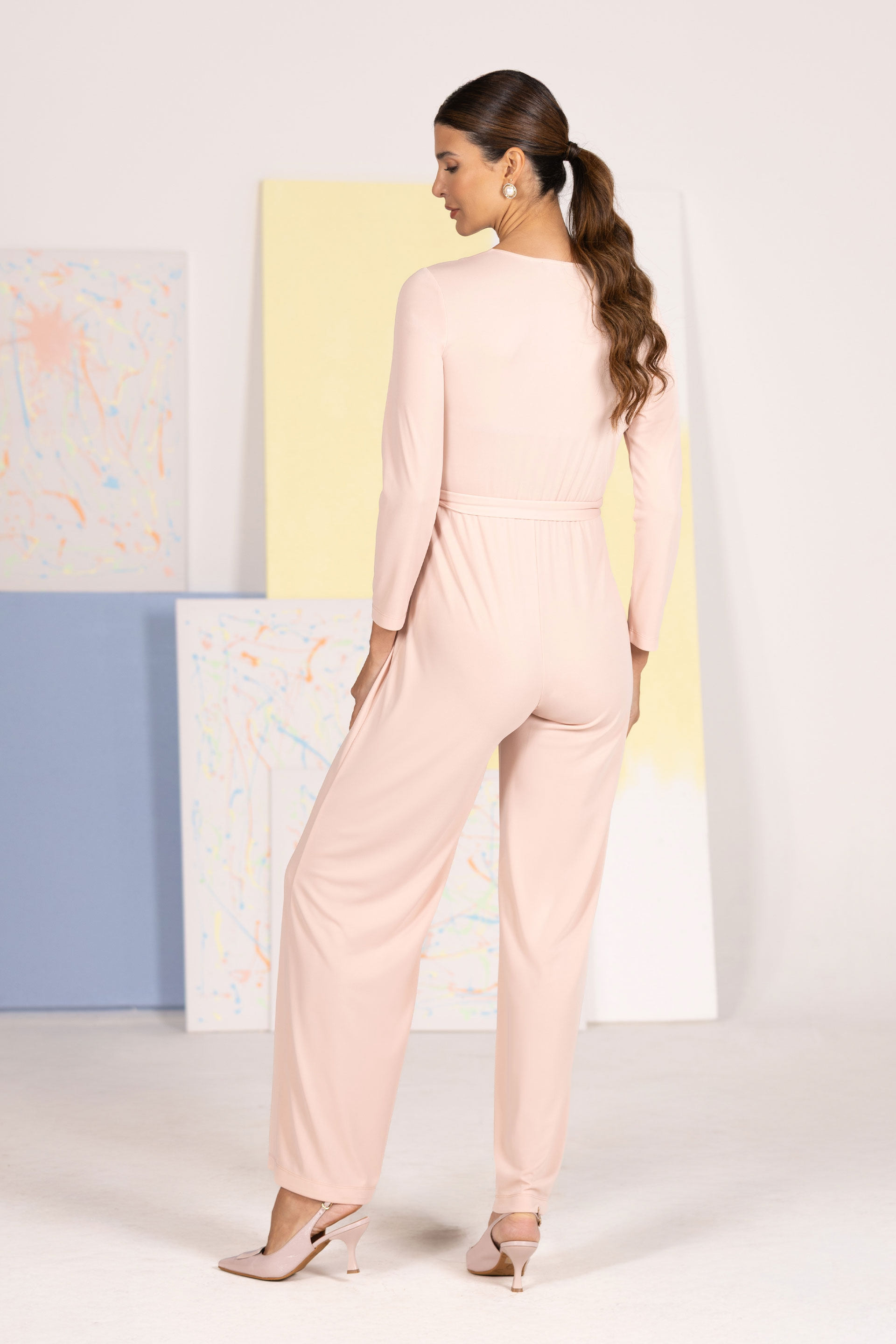 Fluid women’s jumpsuit with crossover neckline and belt