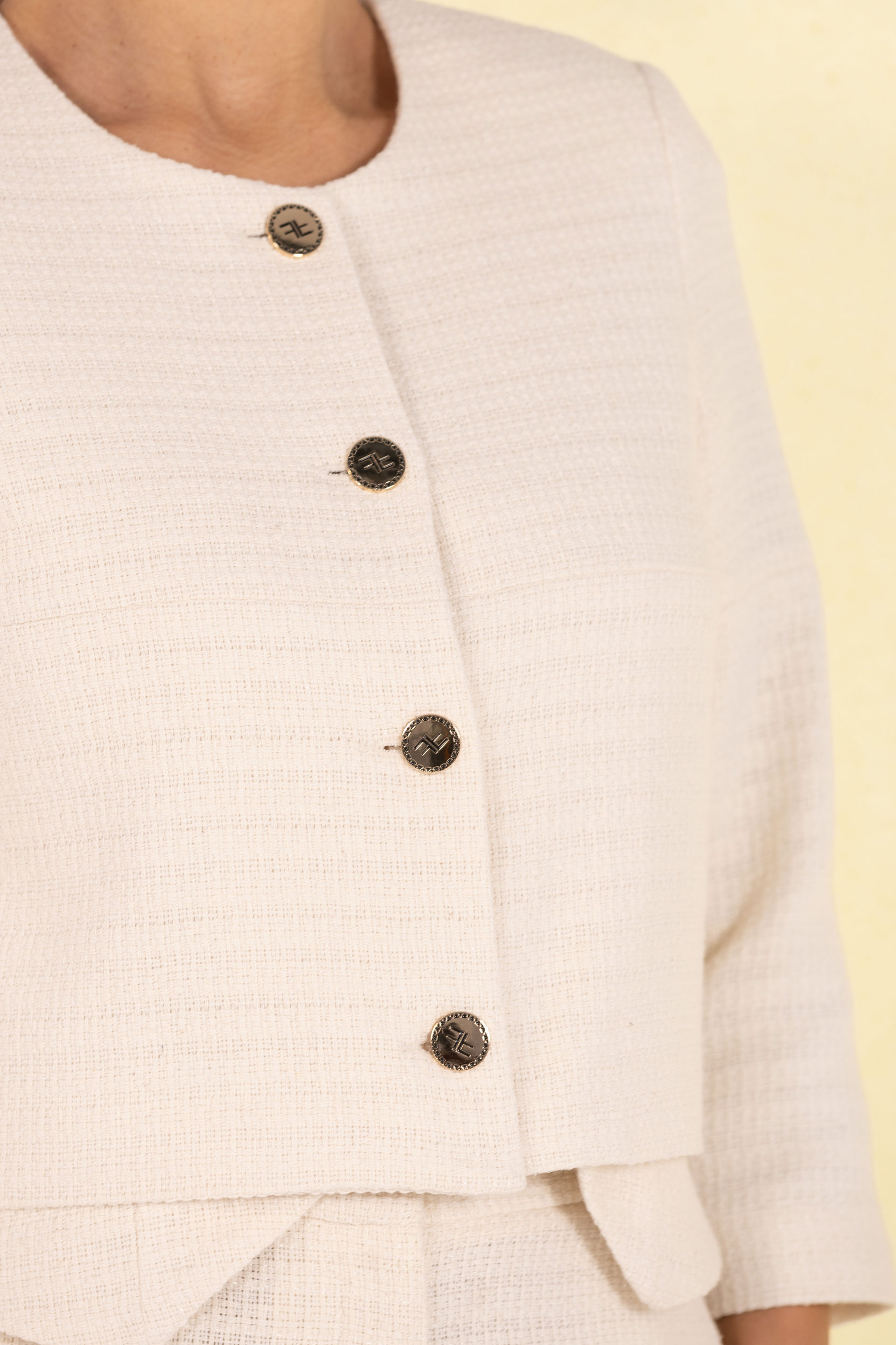 Short textured jacket with metal buttons