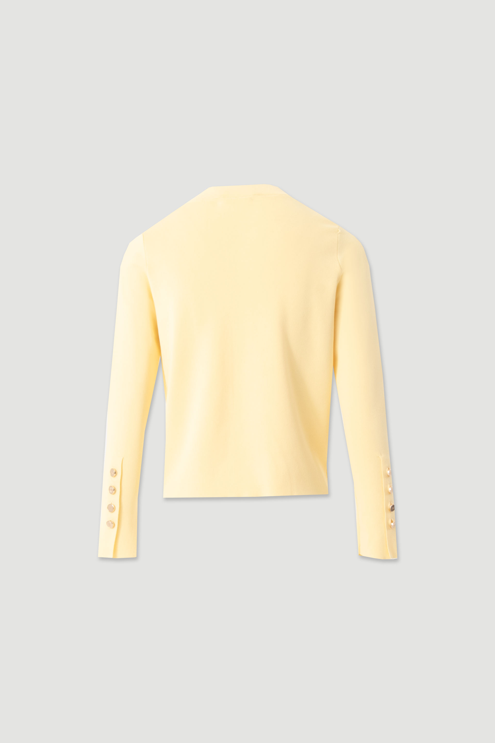 Short knitted cardigan with custom buttons