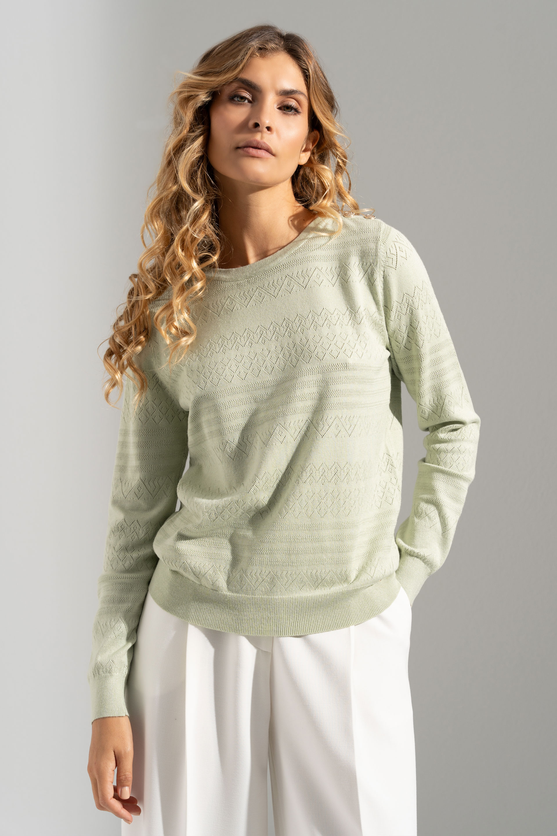 Textured knit sweater with decorative shoulder buttons