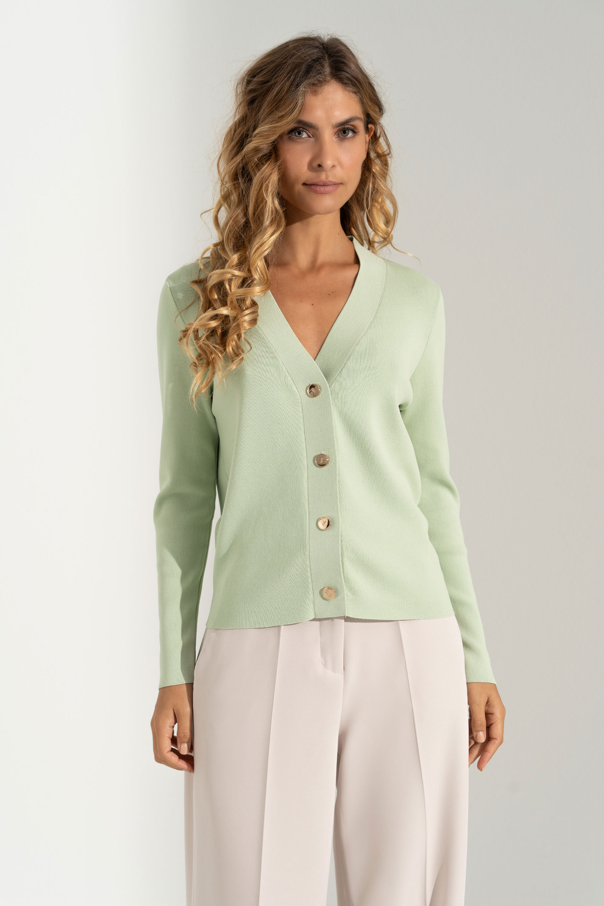 Short knitted cardigan with custom buttons