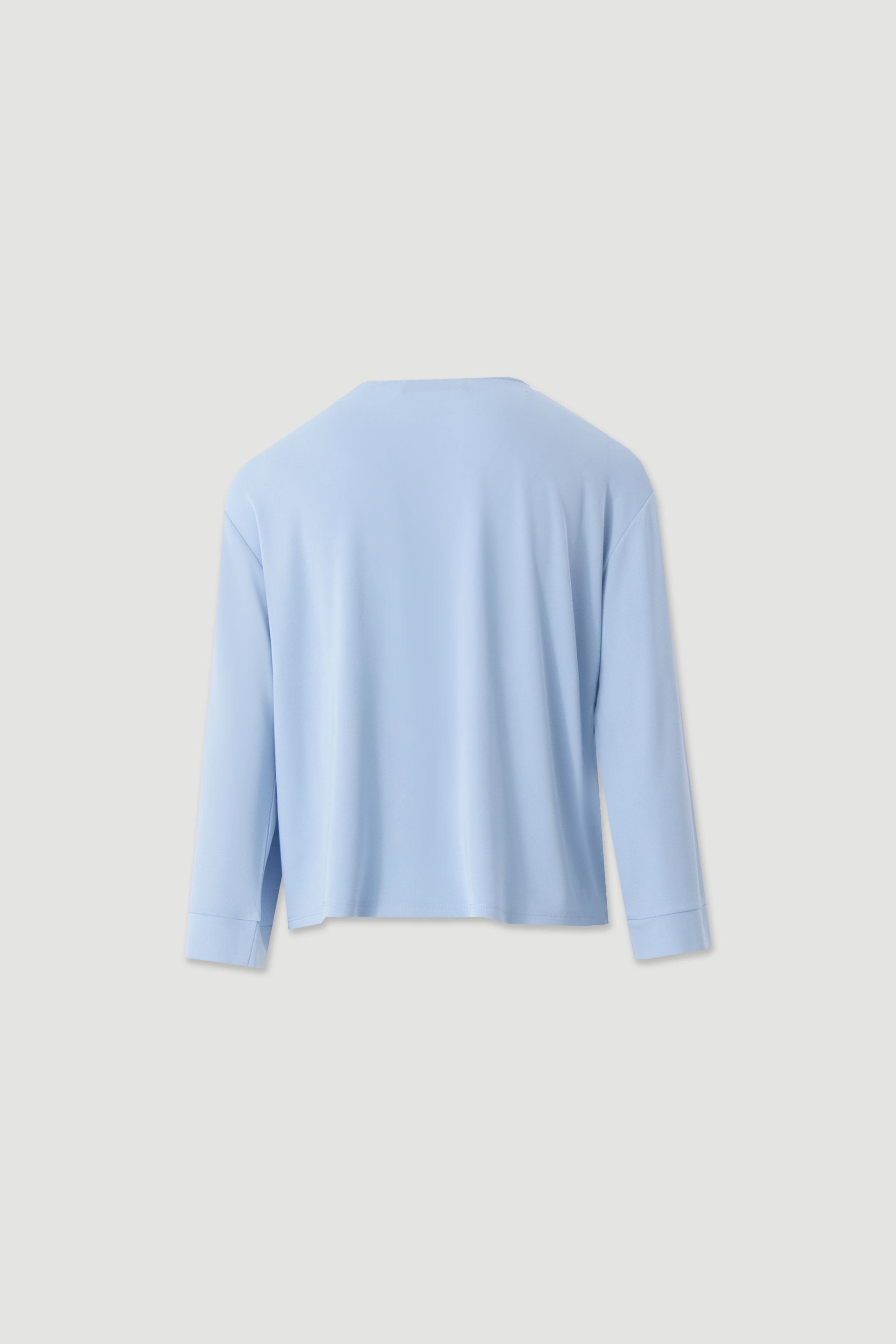 Tunic with decorative shoulder buttons