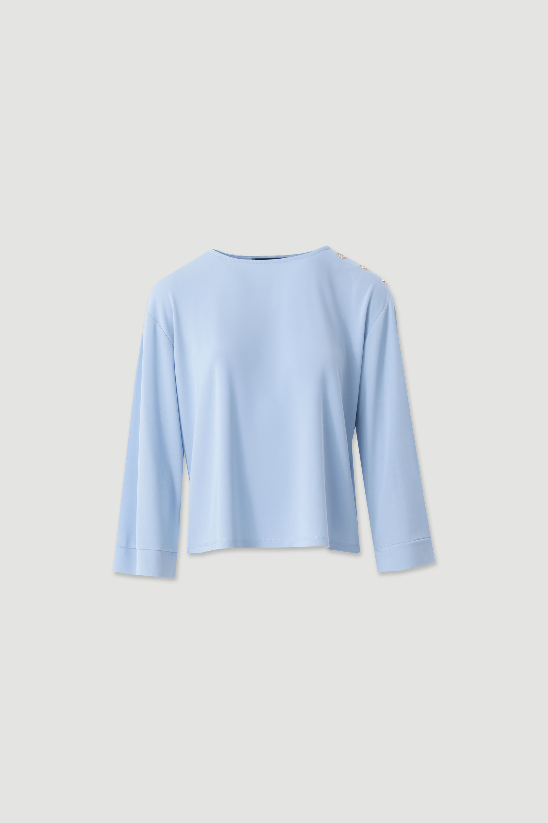 Tunic with decorative shoulder buttons