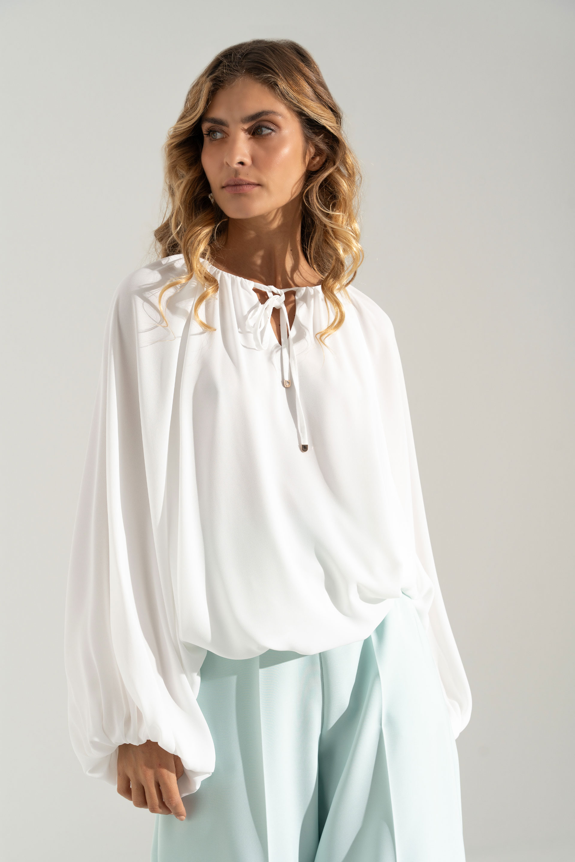 Flowing tunic with adjustable neckline
