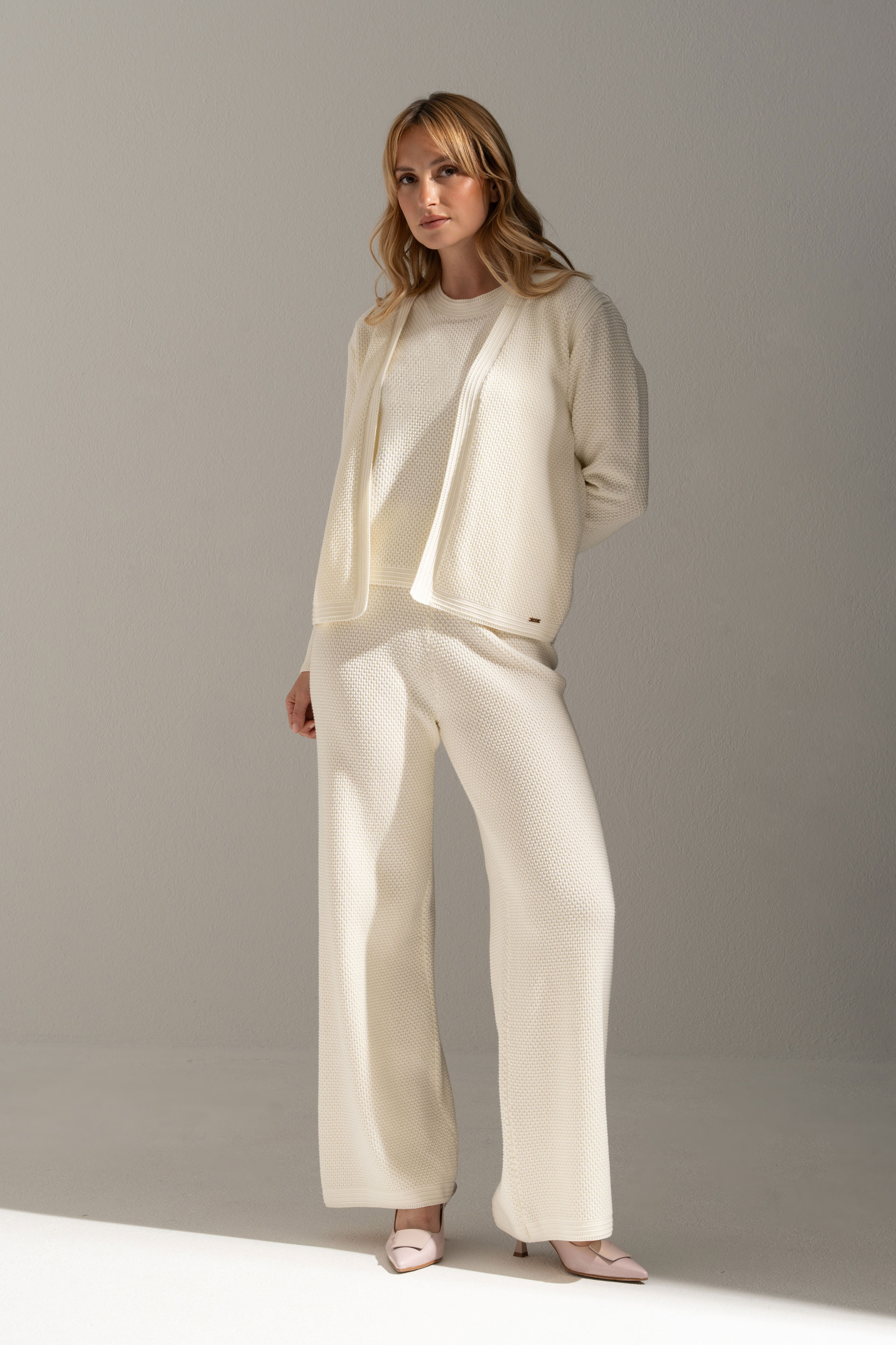 Perforated knit trousers in 100% cotton